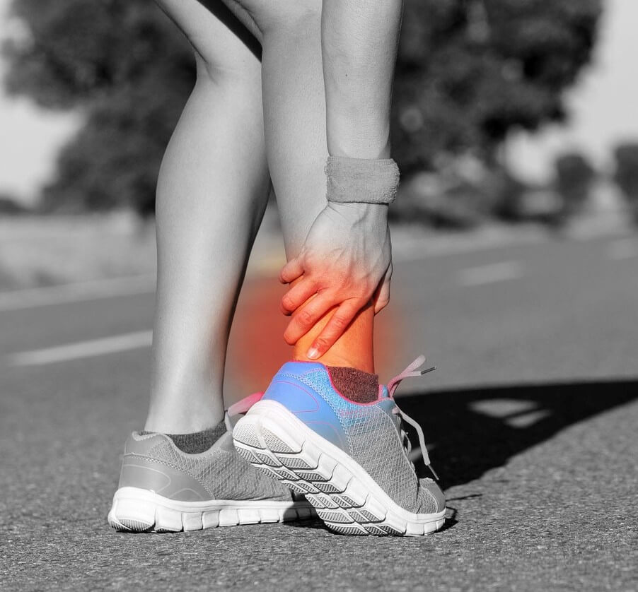 A runner on a road suffering Achilles tendon pain